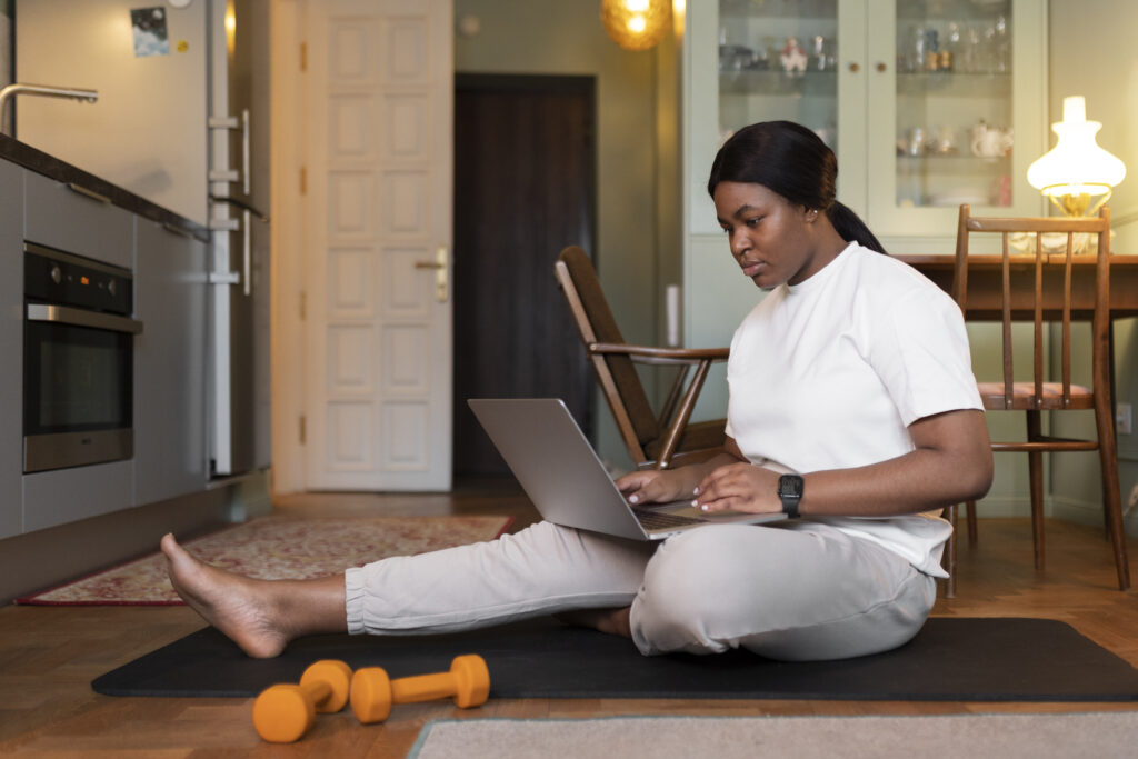 close up woman exercising after online instructor