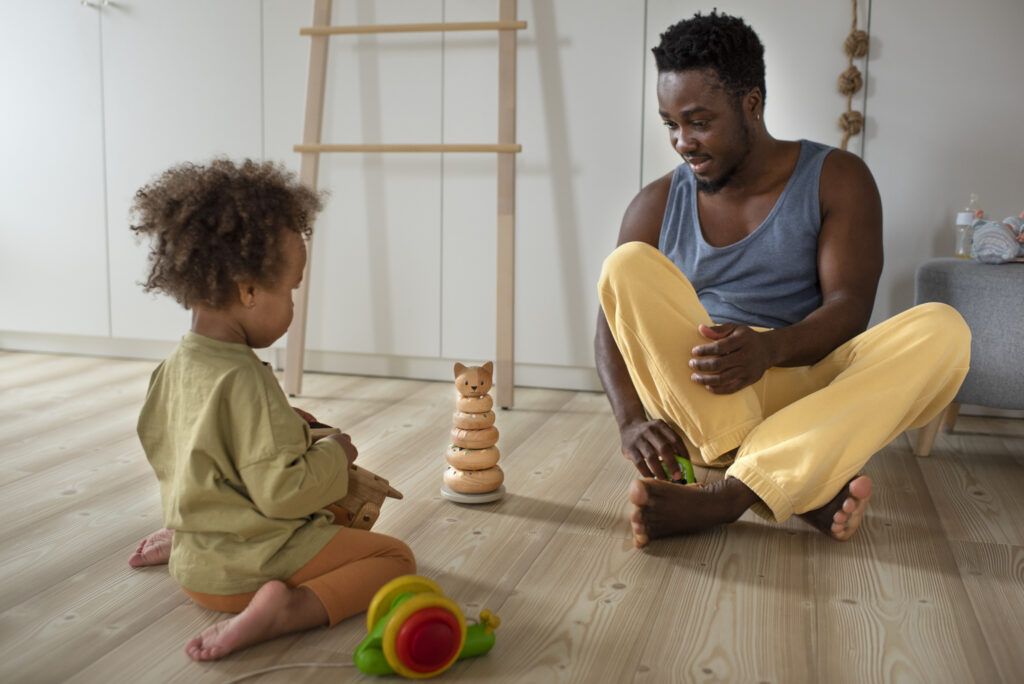 dad spending time with his black baby