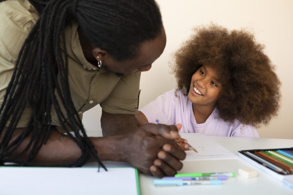 father helping his daughter with homework
