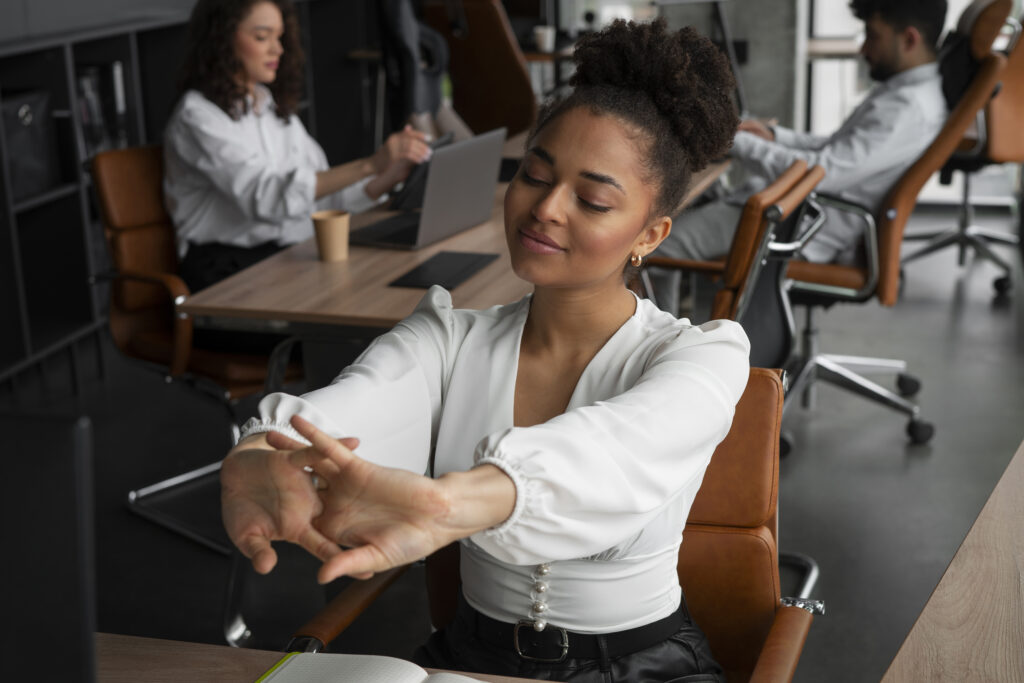 medium shot woman stretching work