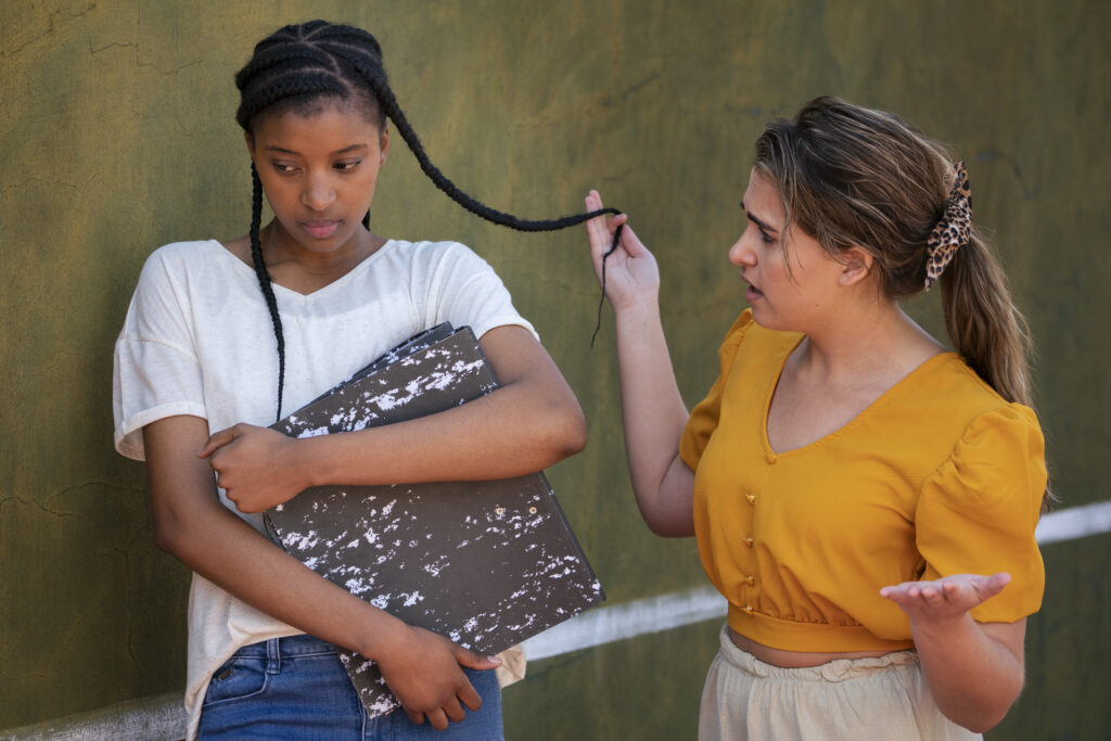 person judging scolding another person outdoors