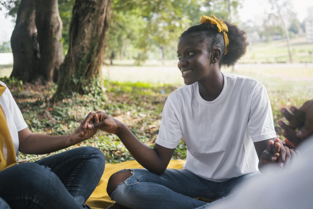 The Role of Community in Supporting Mental Wellness women holding hands close up