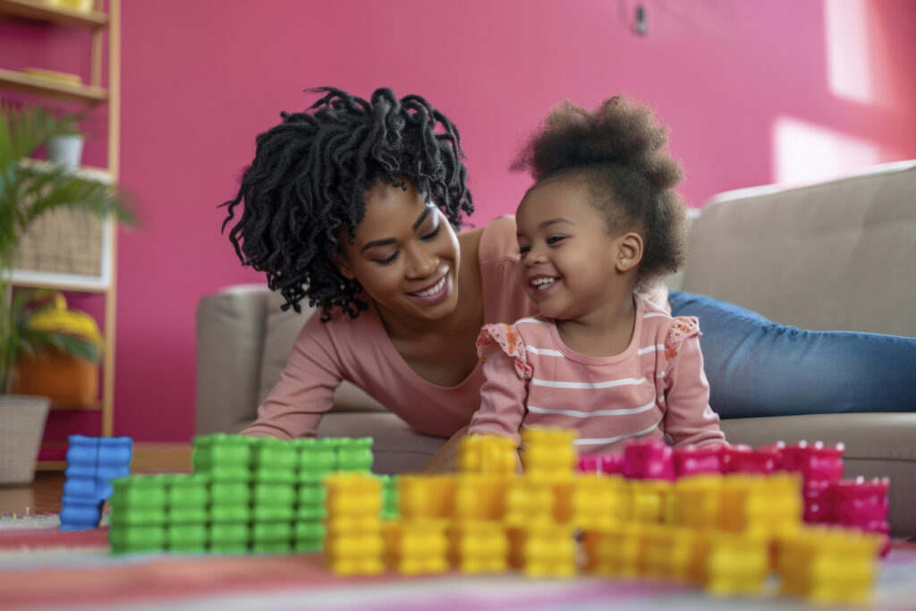 young child with autism playing with family